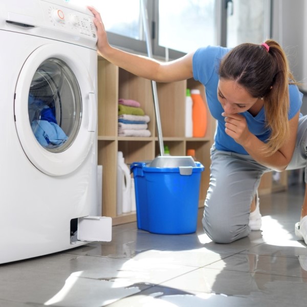 why would a washing machine leak from underneath